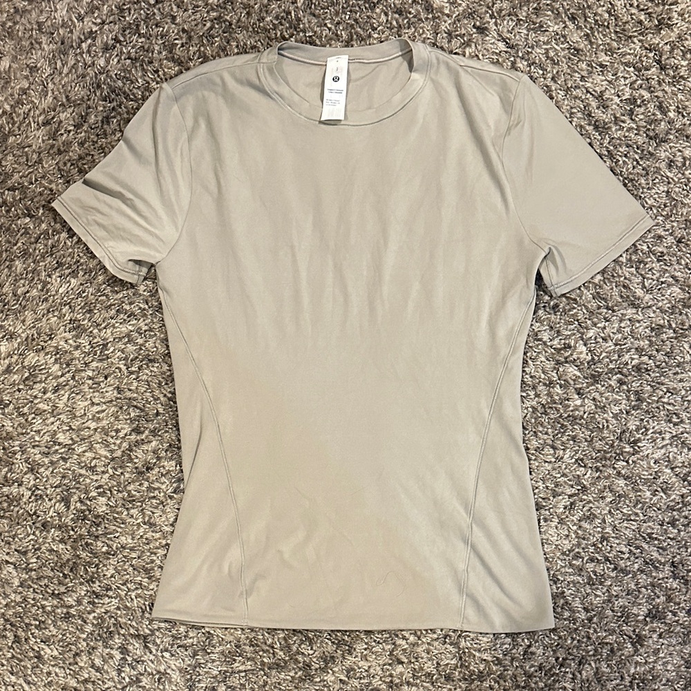 Brand new never worn lululemon athletica Women's Short Sleeve Top in Light cream